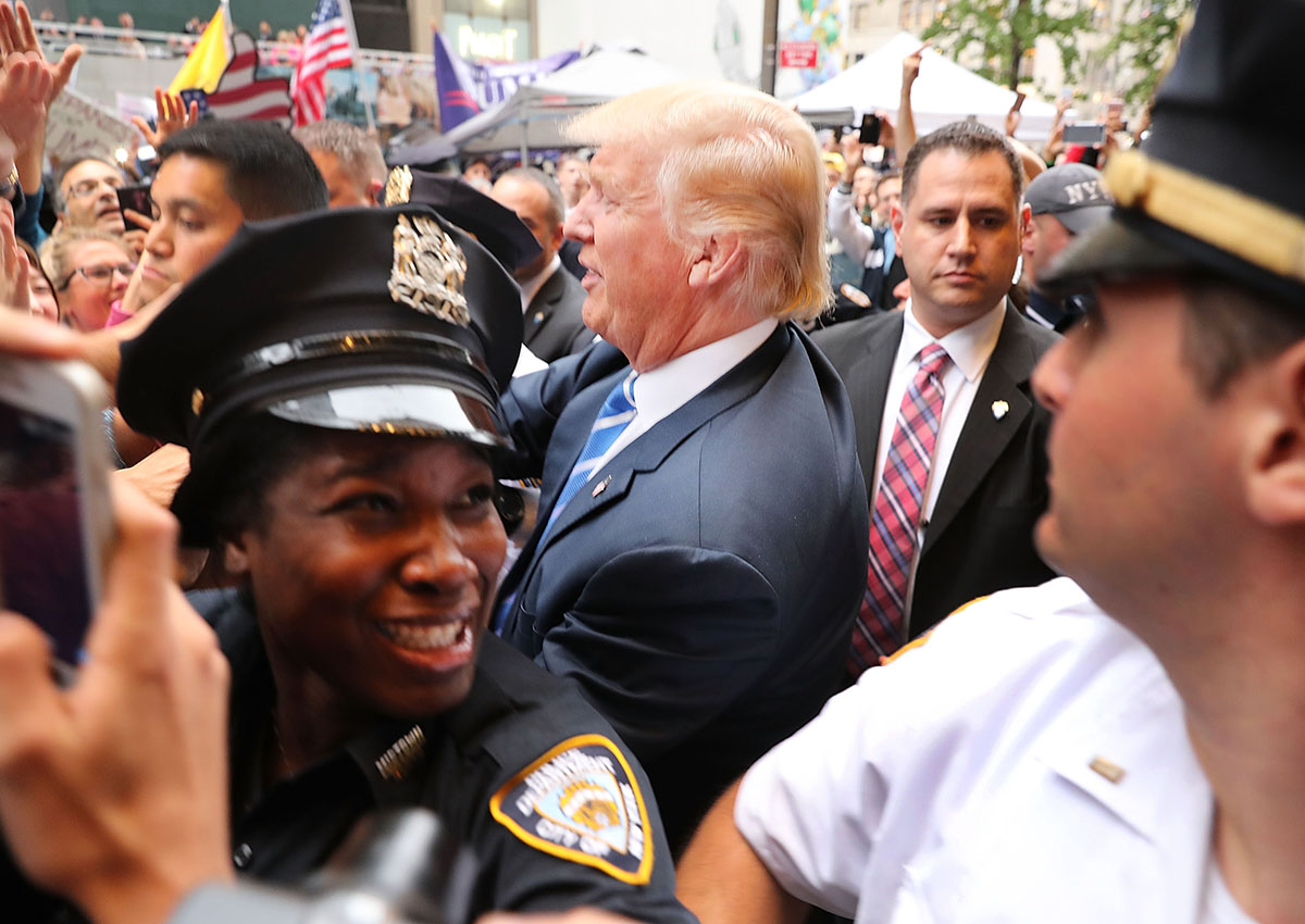 Donald Trump greets supporters  outside of Trump Towers in Manhattan October 8, 2016 in New York City. The Donald Trump campaign has faced numerous calls for him to step aside after a recording from 2005 revealed lewd comments Trump made about women.