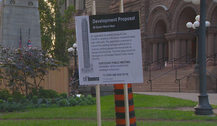 A sign erected at Old City Hall recently shows a fake proposal for a 90-storey condo.