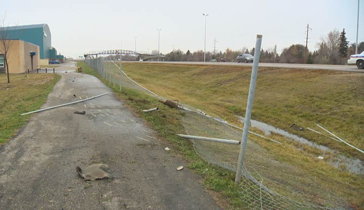 A stolen truck attempting to evade police crashed into a fence by a Saskatoon school on Sunday afternoon.