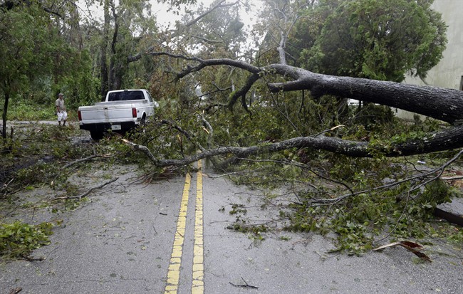 A truck negotiates around trees downed by Hurricane Matthew, Friday, Oct. 7, 2016, in Daytona Beach, Fla. Hurricane Matthew spared Florida‚Äôs most heavily populated stretch from a catastrophic blow Friday but threatened some of the South‚Äôs most historic and picturesque cities with ruinous flooding and wind damage as it pushed its way up the coastline. 
