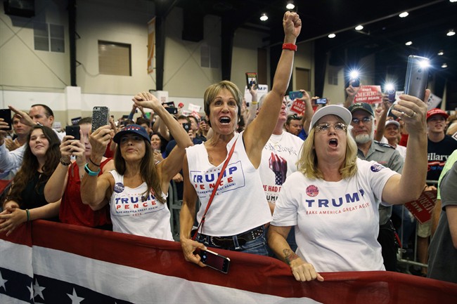 Supporters of Republican presidential candidate Donald Trump cheer during a campaign rally at the South Florida Fairgrounds and Convention Center, Thursday, Oct. 13, 2016, in West Palm Beach, Fla. 