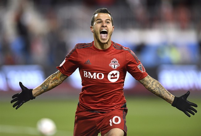 Toronto FC's Sebastian Giovinco celebrates his goal against the Philadelphia Union during first half MLS soccer playoff action in Toronto, Wednesday, October 26, 2016. THE CANADIAN PRESS/Frank Gunn.