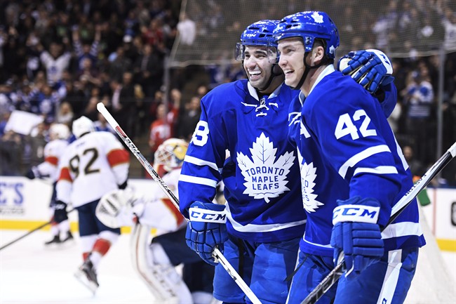 Toronto Maple Leafs centre Tyler Bozak (42) celebrates his goal against the Florida Panthers with teammate Nazem Kadri (43) during second period NHL hockey action in Toronto on Thursday, October 27, 2016. THE CANADIAN PRESS/Frank Gunn.