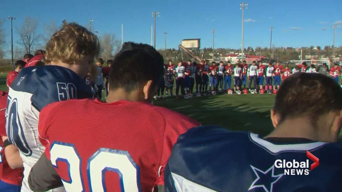 Students held a pre-game prayer at a football game between the Crescent Heights Cowboys and the Churchill Bulldogs Wednesday afternoon.