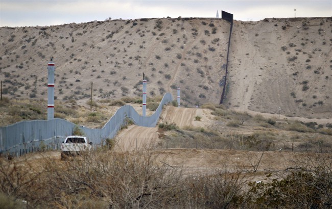 A U.S. Border Patrol agent drives near the U.S.-Mexico border fence in Sunland Park, N.M. in this Jan. 4, 2016 file photo. 