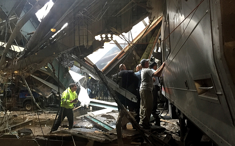 Train personel survey the NJ Transit train that crashed in to the platform at the Hoboken Terminal September 29, 2016 in Hoboken, New Jersey. New Jersey emergency's management system is reporting more than 100 people were injured in the crash.