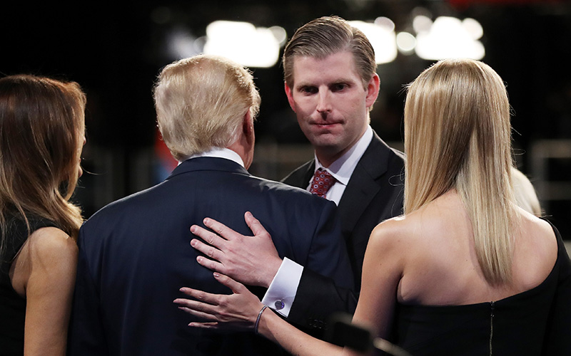 Republican presidential nominee Donald Trump stands on stage with his wife Melania Trump as he's embraced by Eric Trump and Ivanka Trump during the third U.S. presidential debate at the Thomas & Mack Center on October 19, 2016 in Las Vegas, Nevada. 