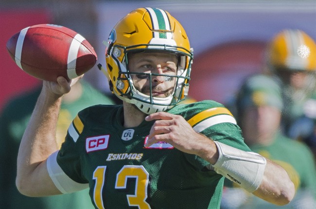 Edmonton Eskimos' quarterback Mike Reilly throws a pass during first half CFL football action against the Montreal Alouettes in Montreal, Monday, October 10, 2016. Reilly and running back John White and B.C. receiver Bryan Burnham are the CFL top performers for Week 16. 