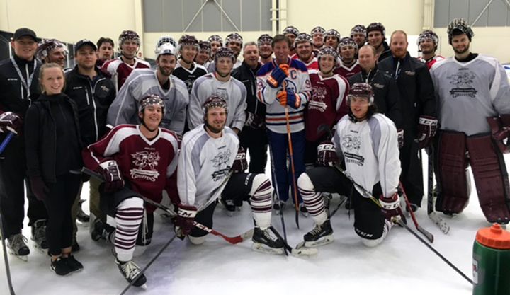 Wayne Gretzky poses for a photo with the MacEwan University Griffins hockey team after he surprised them by showing up to their practice on Oct. 12, 2016.