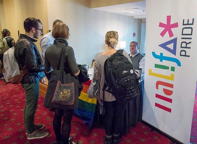 Participants register at the Halifax Pride annual general meeting in Halifax on Wednesday, Oct. 5, 2016.