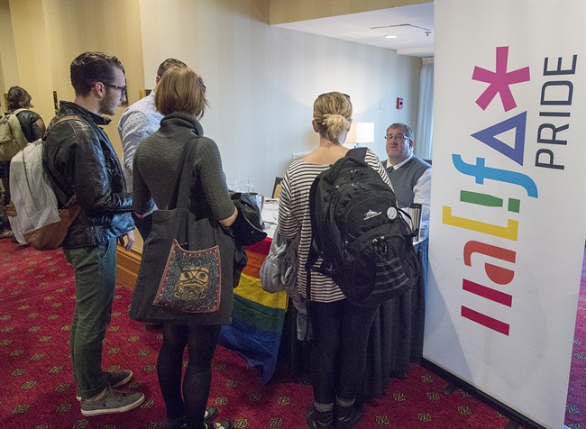 Participants register at the Halifax Pride annual general meeting in Halifax on Wednesday, Oct. 5, 2016.