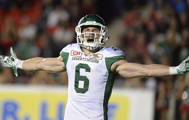 Saskatchewan Roughriders' Rob Bagg (6) reacts after scoring a touchdown against the Ottawa Redblacks during second half CFL action on Friday, Oct. 7, 2016 in Ottawa.
