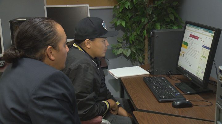 Chaston Dustyhorn (right) and Cory Alexson (left) look for potential jobs Friday at Saskatoon's White Buffalo Youth Lodge.