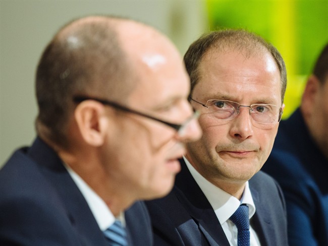 Saxony criminal police chief Joerg Michaelis and Saxony's Interior Minister Markus Ulbig, from left, attend a news conference in Dresden, eastern Germany.