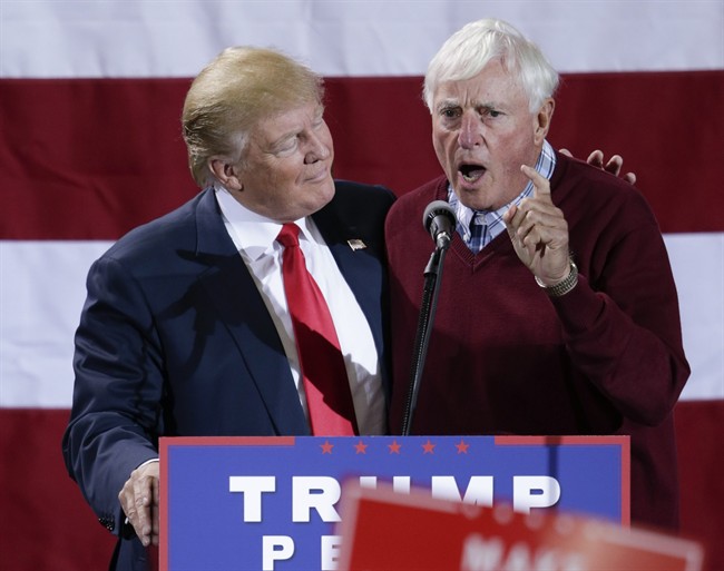 Republican presidential candidate Donald Trump is endorsed by former coach Bobby Knight, during a campaign rally in Grand Rapids, Mich., Monday, Oct. 31, 2016.
