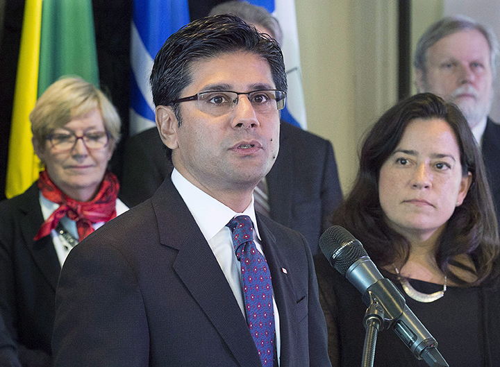 Ontario Attorney General Yasir Naqvi fields a question as federal Justice Minister Jody Wilson-Raybould, right, looks on at the closing news conference of a meeting of federal, provincial and territorial justice and public safety ministers in Halifax on Friday, Oct. 14, 2016. 