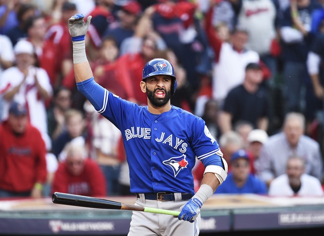 Toronto Blue Jays right fielder Jose Bautista (19) reacts at the plate against the Cleveland Indians during third inning, game two American League Championship Series baseball action in Cleveland on Saturday, October 15, 2016.