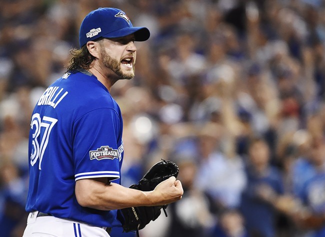Toronto Blue Jays relief pitcher Jason Grilli (37) reacts on his way to the dugout against the Cleveland Indians during eighth inning, game four American League Championship Series baseball action in Toronto on Tuesday, October 18, 2016.
