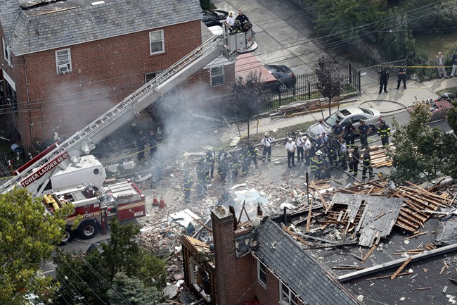 In this Sept. 27, 2016 file photo, emergency service personnel work at the scene of a house explosion in the Bronx borough of New York. 