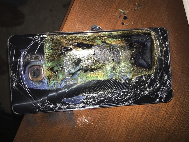 This Sunday, Oct. 9, 2016, photo shows a damaged Samsung Galaxy Note 7 on a table in Richmond, Va., after it caught fire earlier in the day. Samsung Electronics said Tuesday, Oct. 11, that it is discontinuing production of Galaxy Note 7 smartphones permanently, a day after stopping global sales of the ill-fated devices. (Shawn L. Minter via AP).