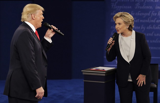 Donald Trump and Hillary Clinton speak during the second presidential debate at Washington University in St. Louis in this Sunday, Oct. 9, 2016 file photo.