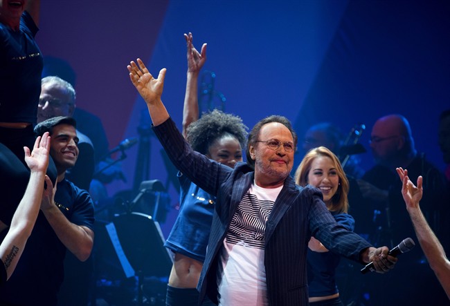 Entertainer Billy Crystal performs the opening number during a benefit concert for the Hillary Victory Fund Monday, Oct. 17, 2016, in New York.