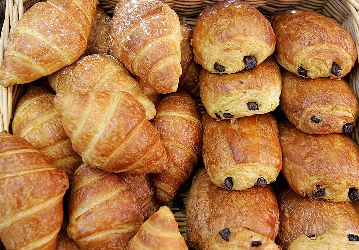 Pain Au Chocolate and croissants are stacked for sale on a stall. One would be so lucky as to find a bakery in France willing to hand over a pain au chocolate for much less than a euro (about C$1.50).