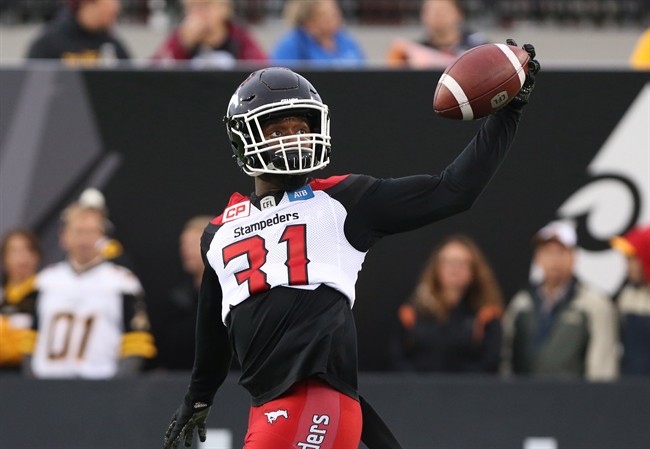 Calgary Stampeders defensive back Jamar Wall, normally #29, wears the number of teammate Mylan Hicks (31) during pre-game warm-ups before CFL football action against the Hamilton Tiger-Cats in Hamilton, Ont., on Saturday, October 1, 2016. 