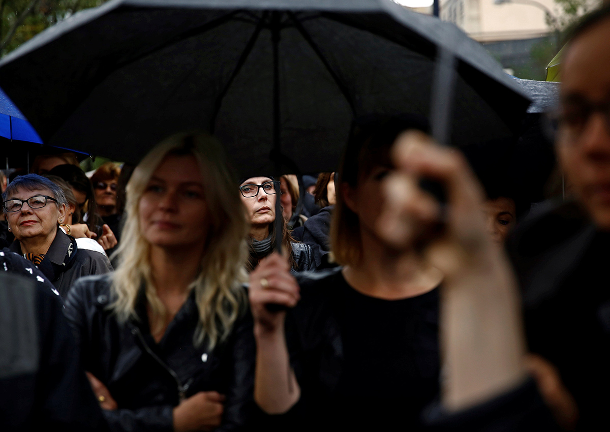 A woman looks on as she takes part in an abortion rights campaigners' demonstration "Black Protest" in front of the Parliament in Warsaw, Poland October 1, 2016.