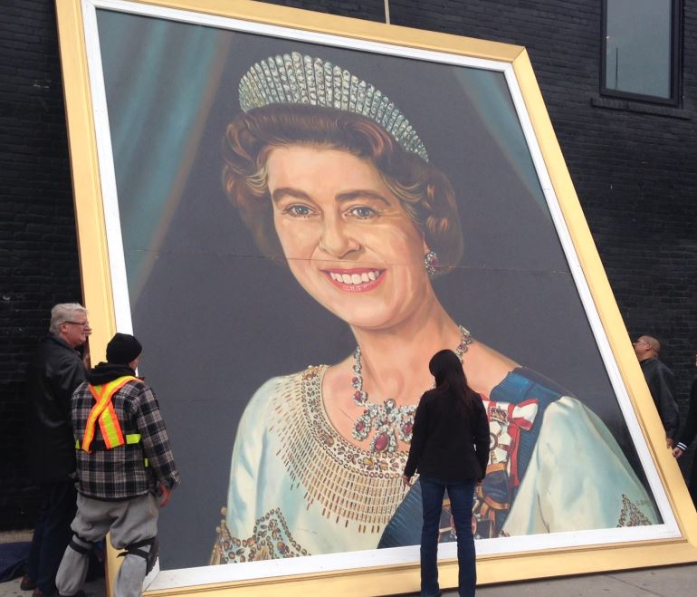 18 foot portrait of the queen hanging outside The Pint.