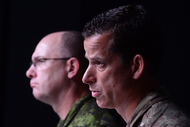 Brigadier-General Peter Dawe (right) speaks as the Canadian Armed Forces provides an update on Operation IMPACT in the Middle East during a press conference at National Defence headquaters in Ottawa on Thursday, Oct. 6, 2016.