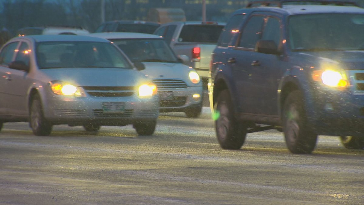Drivers navigate the streets under the first snowfall,
.