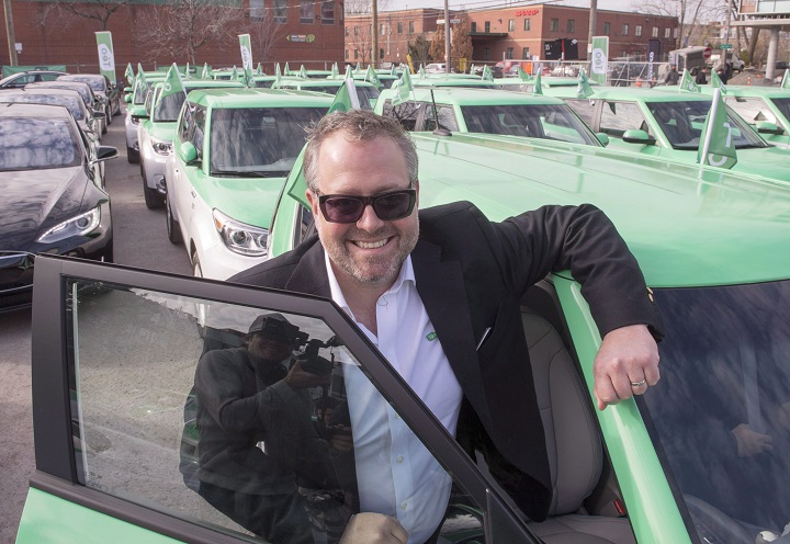 In this file photo, Alexandre Taillefer poses for photos with his new fleet of electric taxis at the launch Wednesday, November 18, 2015 in Montreal. 