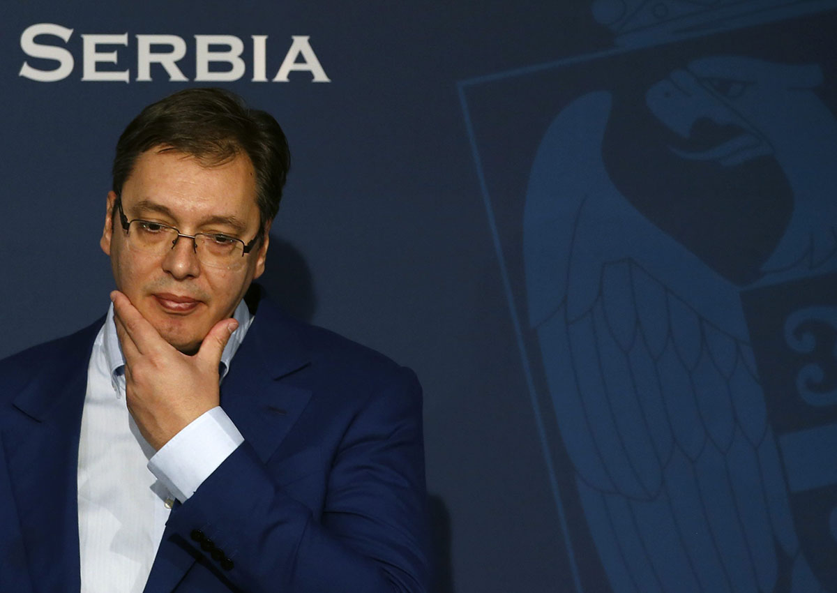 Serbian Prime Minister Aleksandar Vucic gestures, during a press conference, in Belgrade, Serbia, Sunday, Oct. 30, 2016. Vucic was moved to a safe location after a large cache of weapons was found Saturday near his family house outside Belgrade, the interior minister said. (AP Photo/Darko Vojinovic).