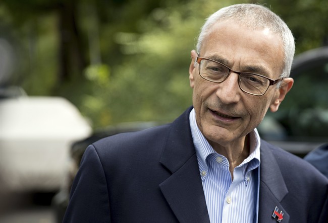 Hillary Clinton campaign chairman John Podesta speaks to members of the media outside Clinton's home in Washington in this Oct. 5, 2016 file photo. 