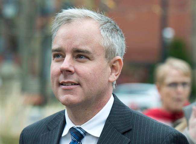 FILE: Dennis Oland heads from a bail hearing after being released from custody in Fredericton on Tuesday, Oct. 25, 2016.