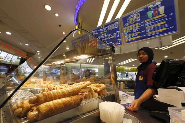 In this Tuesday, Oct. 18, 2016 photo, Pretzel Dogs are on display at Auntie Anne's at a shopping mall in Kuala Lumpur, Malaysia.