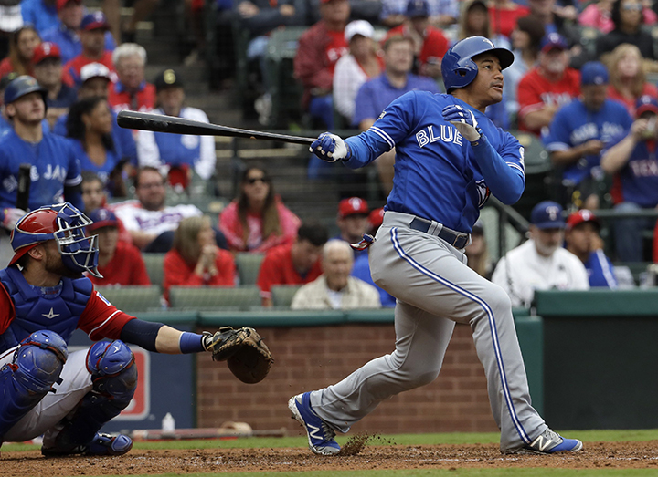 Troy Tulowitzki of the Toronto Blue Jays tags out Adrian Beltre of News  Photo - Getty Images