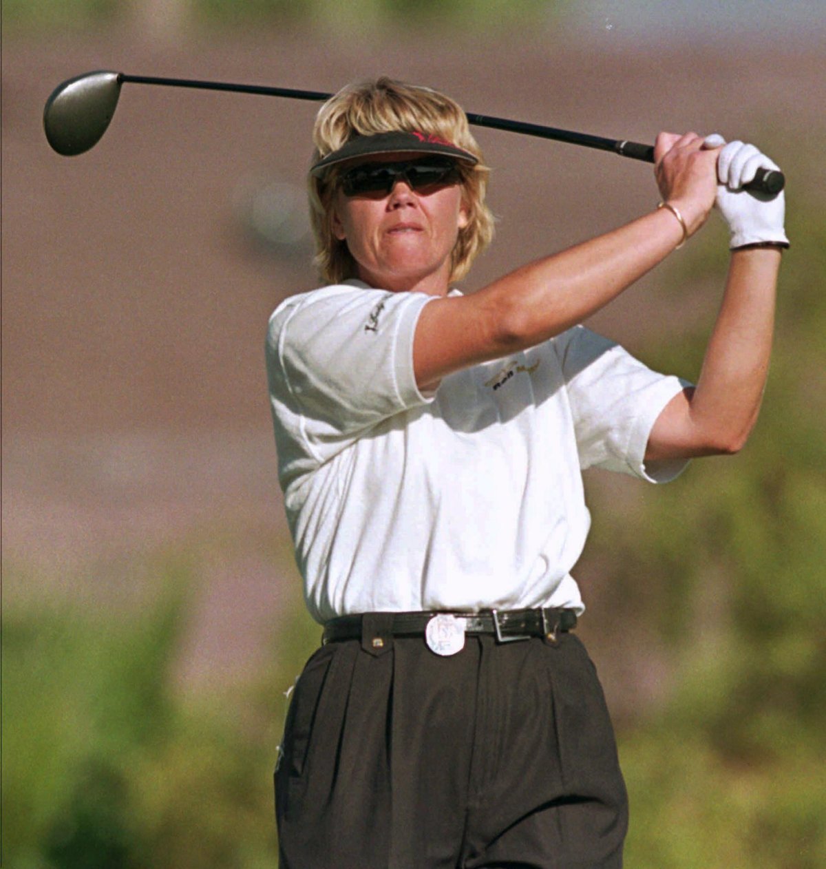 Dawn Coe-Jones watches her tee shot on the 17th hole during the first round of the Standard Register Ping LPGA event at Moon Valley Country Club in Phoenix, Thursday, March 18, 1999. She passed away Nov. 12, 2016. 