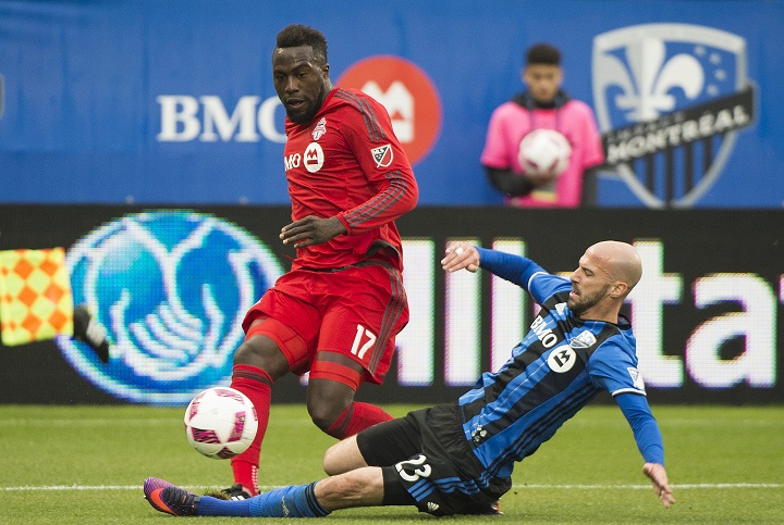 In this file photo, Montreal Impact's Laurent Ciman, right, challenges Toronto FC's Jozy Altidore during first half MLS soccer action in Montreal, Sunday, October 16, 2016.