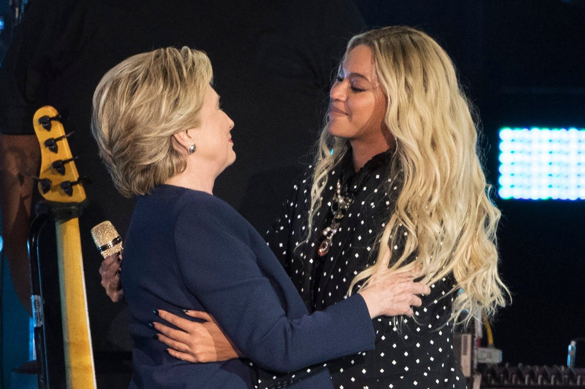 Beyonce, right, and Democratic presidential candidate Hillary Clinton embrace during a campaign rally in Cleveland, Friday, Nov. 4, 2016.