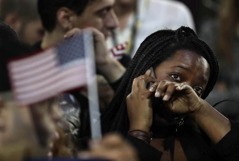 A woman weeps as election results are reported during Democratic presidential nominee Hillary Clinton's election night rally Nov. 8, 2016. 