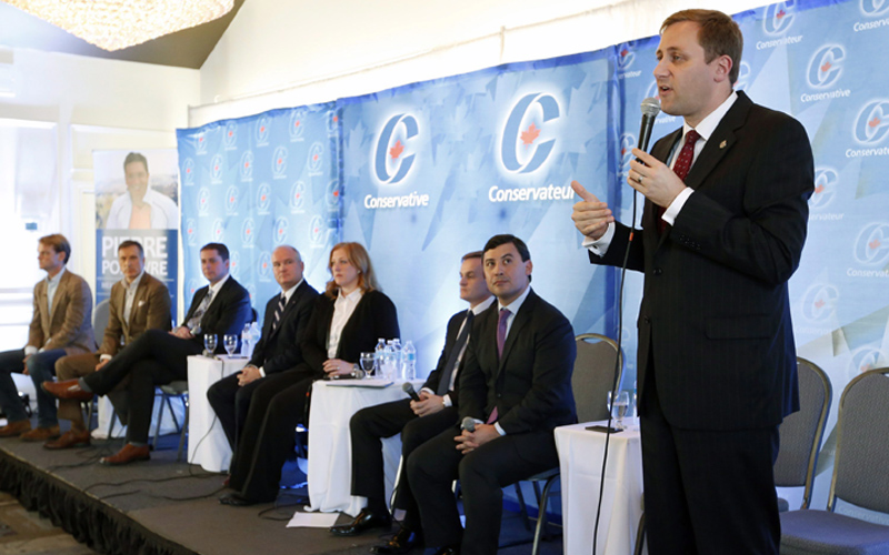 Conservative leadership candidate Brad Trost, right, responds to questions from the audience at a Conservative leadership debate in Greely, Ont., on Sunday, November 13, 2016. 
