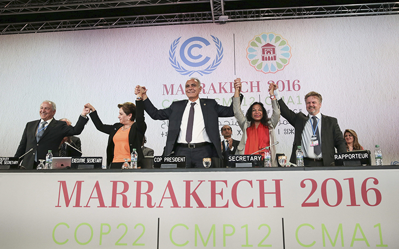 U.N. climate chief Patricia Espinosa, 2nd left, and Morocco's Foreign Minister Salaheddine Mezouar, centre, celebrate after the proclamation of Marrakech, at the COP22 climate change conference, in Marrakech, Morocco, Thursday, Nov. 17, 2016. 