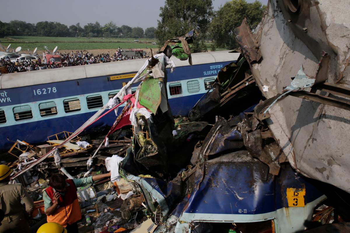 Rescuers work on the site of a train derailment accident in Kanpur Dehat, India, Sunday, Nov. 20, 2016. Many were killed Sunday when 14 coaches of an overnight passenger train rolled off the track in northern India, with rescue workers using cutting torches to try to pull out survivors, police said.