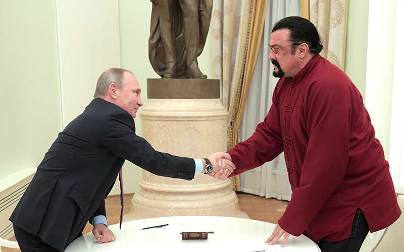 Russian President Vladimir Putin shakes hands with US actor Steven Seagal at the Kremlin in Moscow, Russia, 25 November 2016.