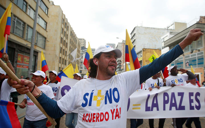 Peace activists make their way into downtown Bogota after starting a trek from Cali in a bid to call for a swift resolution to stalled peace agreement with FARC in Bogota, Colombia, October 24, 2016.