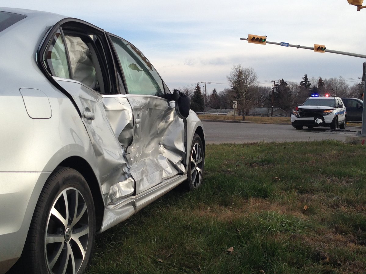 2-car collision involving police cruiser at intersection of 9th Ave. N & McIntosh St.