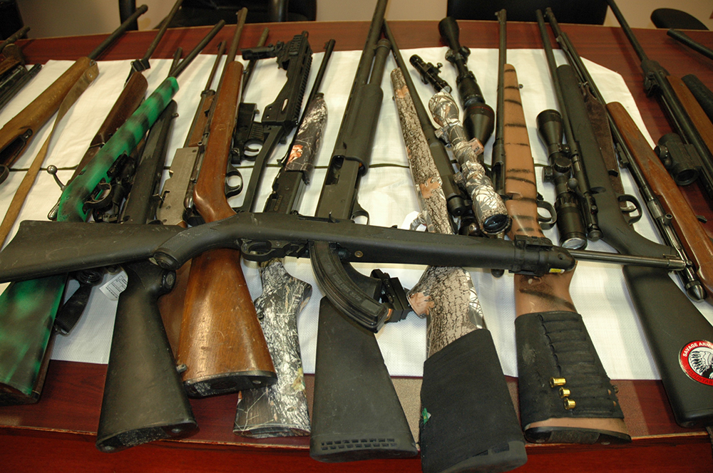 More than a dozen firearms were seized in a small Manitoba town Sunday. 