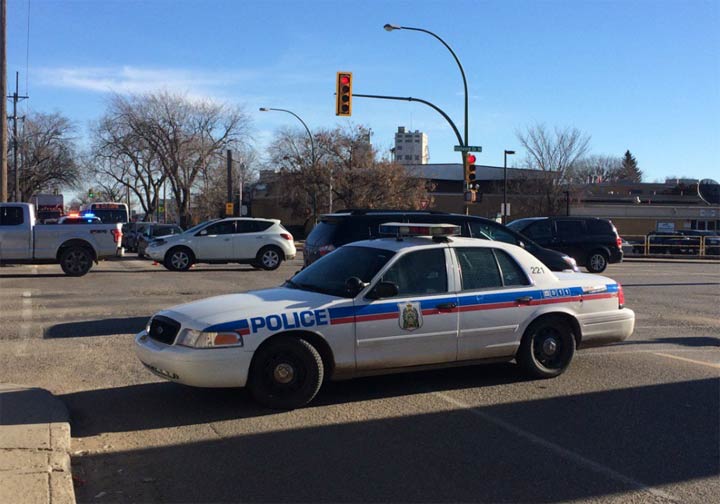 Saskatoon police are laying charges against a woman and the driver involving in a pedestrian collision at Idylwyld Drive and 33rd Street.